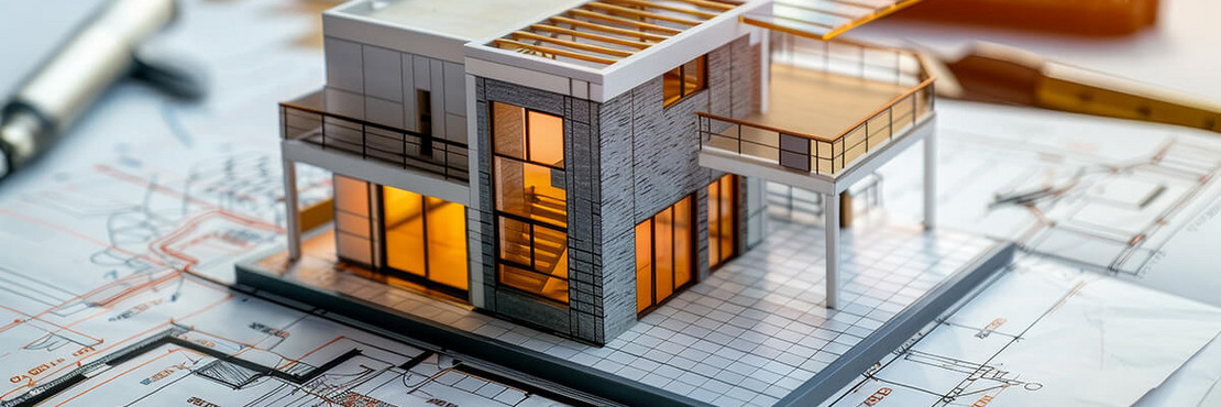Modellhaus mit angegebener Nutzfläche auf einem Plan