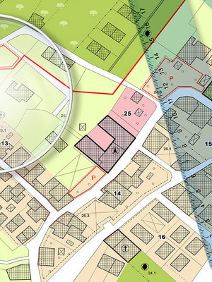Gemeindeentwicklungsplan mit Lupe und Lineal